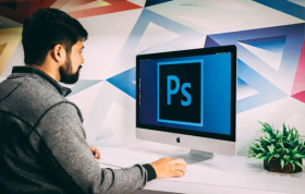 An employee working on Adobe Photoshop on a PC, representing the Adobe Photoshop Online Course.