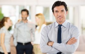 Man in shirt and tie presenting to a group, representing the AgilePM Foundation and Practitioner Course with confident engagement.