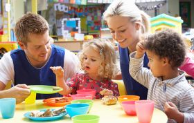 Joyful family playing in preschool classroom, representing the CACHE Level 3 Award in Preparing to Work in Home Based Childcare course.