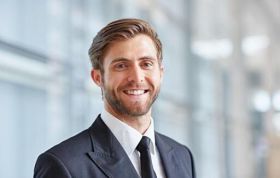 Well-dressed happy man, representing CompTIA Cloud Essentials+ for IT and non-technical professionals seeking cloud knowledge.