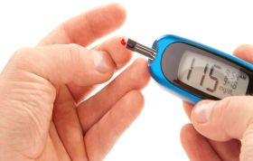 Person testing their blood sugar with a diabetes kit, representing Diabetes Awareness course to learn more about diabetes and its management.
