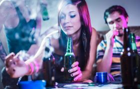 Image of a girl and two boys with alcohol and drugs, illustrating the risks of Drugs and Alcohol to your business.