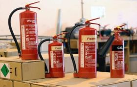 Various fire extinguishers displayed, highlighting training on different types of fire extinguishers in the Fire Extinguisher Online course.