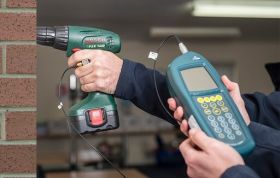 Man using a hand-arm vibration tool, emphasizing Hand-Arm Vibration and risks of frequent exposure in the workplace.