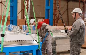 Two men in hard hats operate machinery in an industrial setting, representing the Introduction to LOLER Online training course.