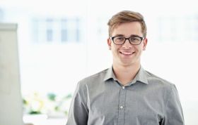 Smiling employee representing Microsoft Windows Server 2012 Administration Exam 70-411 with Practice Lab course.