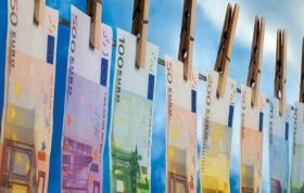 Euros banknotes clipped to clothes pegs, representing the Money Laundering Awareness Online course for understanding financial crime prevention.