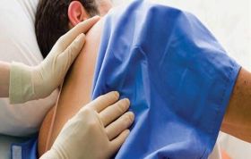 Patient in a hospital bed receiving an injection, representing the Pressure Ulcer Prevention (Acute) Online course for healthcare professionals.