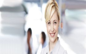 Woman in white shirt smiling warmly at camera, representing the SQL Training Bundle course for comprehensive database skills.