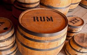 A bottle of rum on a bar counter, representing the Basics of Rum Collection Online Course.